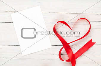 Photo frame or gift card with valentines heart shaped ribbon