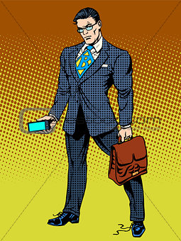Stern businessman with smartphone