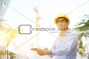 Asian Indian male contractor engineer inspecting at site