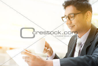 Business people using tablet pc at cafe