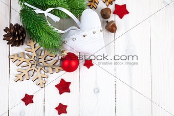 Christmas fir with balls and snowflake on wooden board