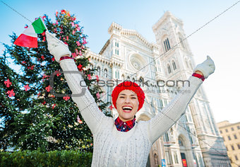 Woman traveler with Italian flag enjoying Christmas in Florence