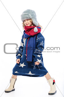 Girl wearing winter fur hat.