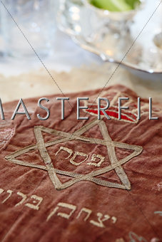 Matzah cover at a passover seder.