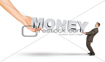 Businessman and hand holding word money