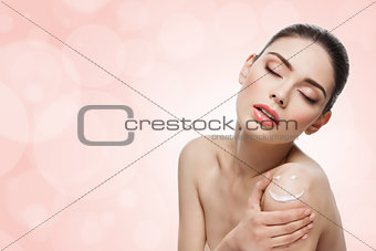 Girl with cream on skin