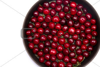 Red cherries in round baking tin
