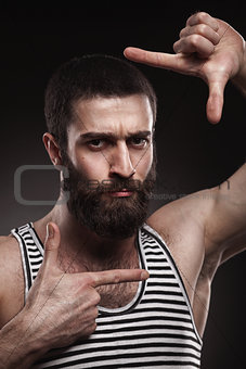 portrait of beardy man in singlet