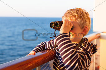 kid cruising with binoculars