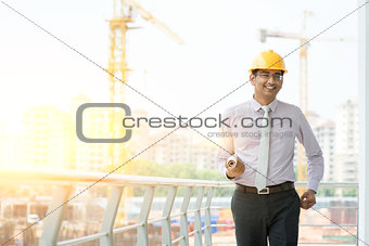 Asian Indian male site contractor engineer walking