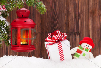 Christmas candle lantern, gift box and snowman