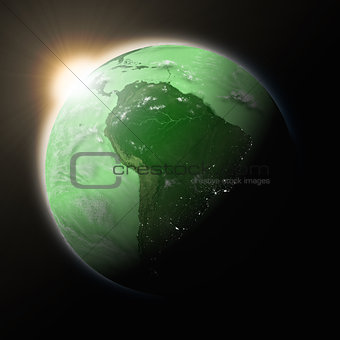 Sun over South America on green planet Earth
