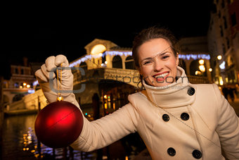 Woman with Christmas Ball near Rialto Bridge in Venice, Italy