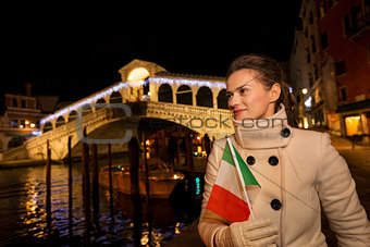 Woman with Italian flag having fun Christmas time in Venice