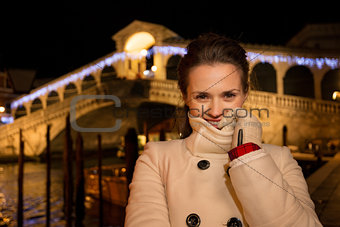 Woman standing near Rialto Bridge in Christmas Venice, Italy