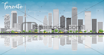 Toronto skyline with grey buildings, blue sky and reflection.