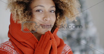 Cute young African woman in winter fashion