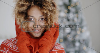 Cute young African woman in winter fashion