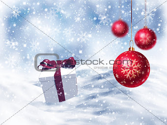 3D Christmas gift nestled in snow with hanging baubles