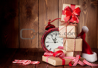 Christmas gift boxes, alarm clock and santa hat