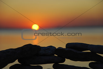 Sunset at a stone wall