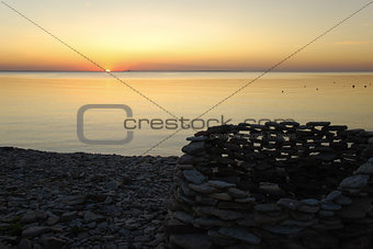 Stone hut by sunset