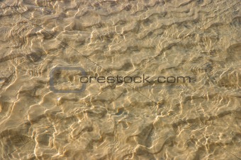 Sand in water