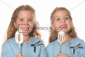 shot of a happy children eating frosting