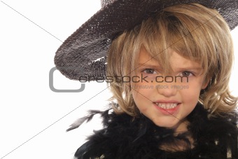 shot of a young child in a wig & hat
