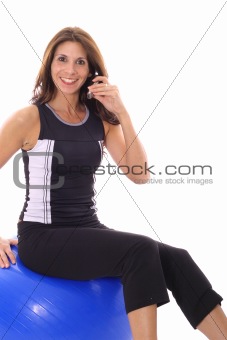 shot of a female taking phone call while working out