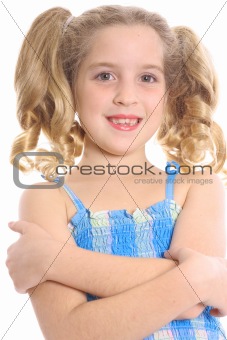 shot of a happy child with arms crossed