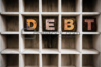 Debt Concept Wooden Letterpress Type in Draw