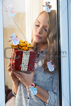 lovely woman with christmas present 