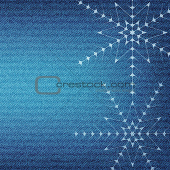 Christmas snowflakes on a blue jeans texture background. 