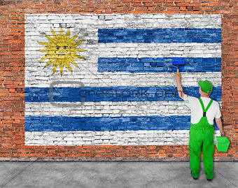 House painter paints flag of Uruguay 