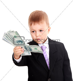 Portrait of a cheerful little boy holding a dollars