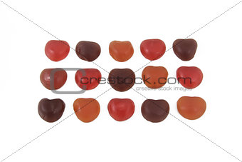 Heart shape colorful jelly are arranged on white background