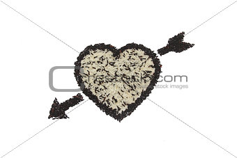 Heart shape and arrow from mix of white rice and black rice on white background
