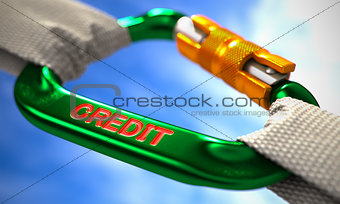 Credit on Green Carabiner between White Ropes.