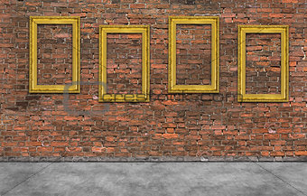 Golden frames on brick wall