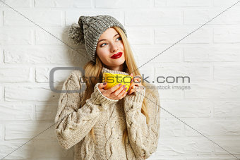 Romantic Dreaming Winter Hipster Girl with a Mug
