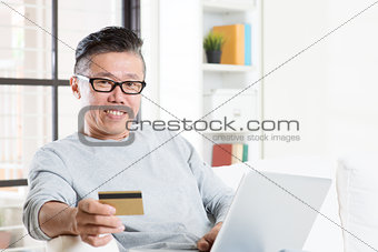 Asian man online shopping