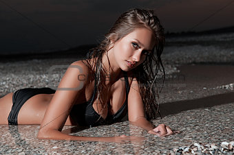Beautiful young woman relaxing near the sea