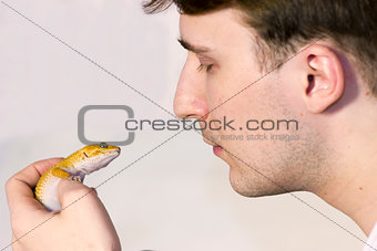 Men and lizard looking at each other