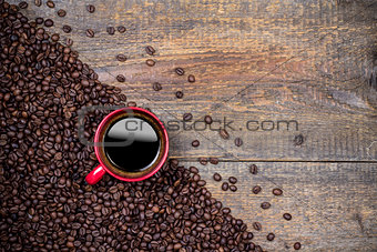 Coffee beans and red coffee cup