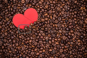 Coffee beans with red paper heart
