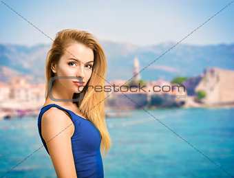 Portrait of Young Woman in Blue Top at Sea