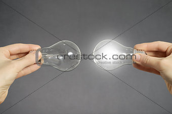 Decision making concept, hands with light bulbs