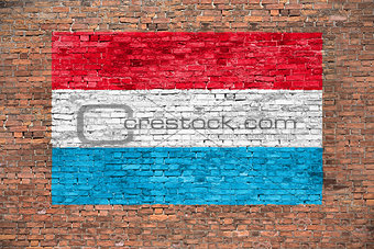 Flag of Luxembourg on brick wall