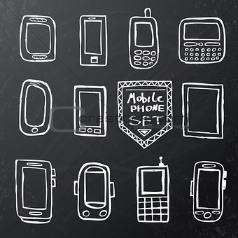 Hand drawn set of mobile gadgets on black chalk board